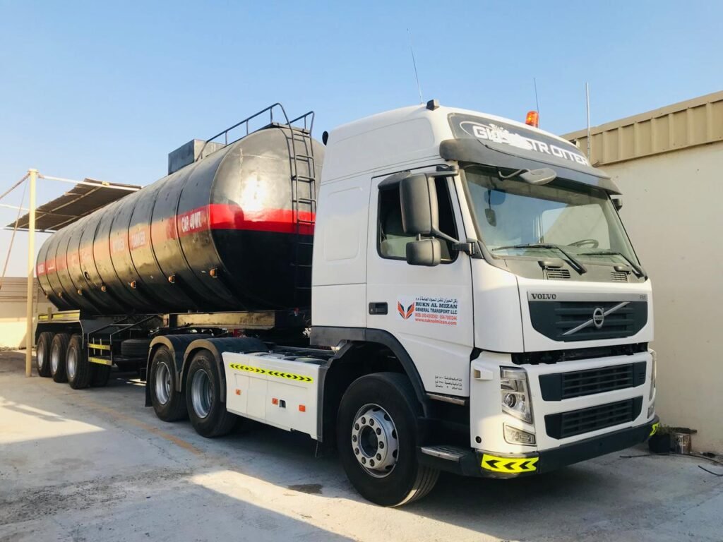 “bitumen transport UAE”, “bitumen tanker rental UAE”, “bitumen tanker rental UAE”, “bulk bitumen transportation”, “hot bitumen delivery”,“40MT bitumen road tanker”, “safe bitumen transport services”, “bitumen logistics UAE”, “bitumen transport Sharjah”, “bitumen transport Dubai”, “bitumen transport Abu Dhabi”, “bitumen transport Ajman”, “bitumen transport Ras Al Khaimah”,“bitumen transport Fujairah”, “bitumen transport Umm Al Quwain”, “Rukn Al Mizan General Transport LLC”, “Bitumen Transport companies in UAE”, “Bitumen Transporters in UAE”, “Asphalt tankers”, “Asphalt Transport UAE”, “Bitumen Drum Filling Services”, “Biggest transport company in UAE”, “Largest transport company in UAE”, “Road tanker transport”, “Bitumen road tankers”, “bitumen drum filling services in UAE”##"Asphalt tanker rental" ##"Bitumen tanker rental" ##"Tanker rental services" ##"Heavy vehicle rental" ##”Best bitumen transport company in UAE” ##”Best bitumen transport” ##”Rent Bitumen tanker trailer 40MT” ##”Transport rental services in UAE” ##”Bitumen tanker companies” ##”Bitumen road tanker rental” ##”Asphalt road tankers services”