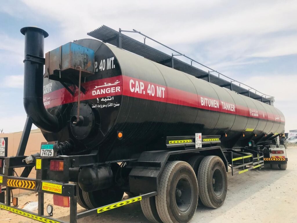 “bitumen transport UAE”, “bitumen tanker rental UAE”, “bitumen tanker rental UAE”, “bulk bitumen transportation”, “hot bitumen delivery”,“40MT bitumen road tanker”, “safe bitumen transport services”, “bitumen logistics UAE”, “bitumen transport Sharjah”, “bitumen transport Dubai”, “bitumen transport Abu Dhabi”, “bitumen transport Ajman”, “bitumen transport Ras Al Khaimah”,“bitumen transport Fujairah”, “bitumen transport Umm Al Quwain”, “Rukn Al Mizan General Transport LLC”, “Bitumen Transport companies in UAE”, “Bitumen Transporters in UAE”, “Asphalt tankers”, “Asphalt Transport UAE”, “Bitumen Drum Filling Services”, “Biggest transport company in UAE”, “Largest transport company in UAE”, “Road tanker transport”, “Bitumen road tankers”, “bitumen drum filling services in UAE”##"Asphalt tanker rental" ##"Bitumen tanker rental" ##"Tanker rental services" ##"Heavy vehicle rental" ##”Best bitumen transport company in UAE” ##”Best bitumen transport” ##”Rent Bitumen tanker trailer 40MT” ##”Transport rental services in UAE” ##”Bitumen tanker companies” ##”Bitumen road tanker rental” ##”Asphalt road tankers services”