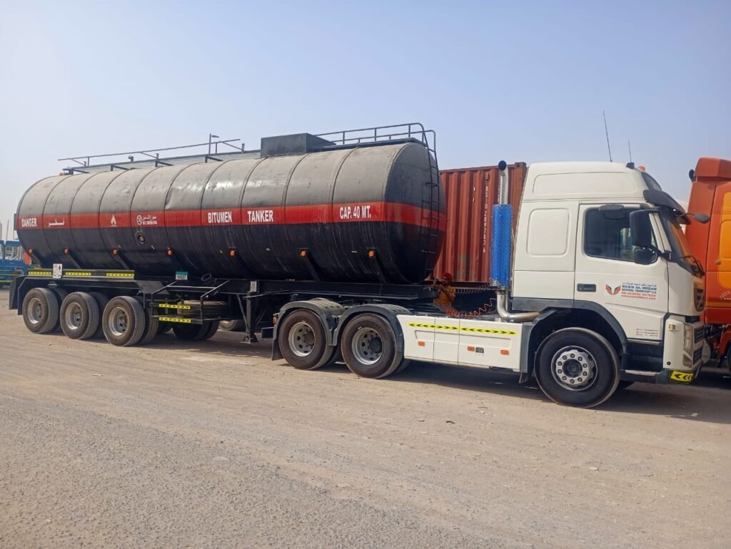 “bitumen transport UAE”, “bitumen tanker rental UAE”, “bitumen tanker rental UAE”, “bulk bitumen transportation”,“hot bitumen delivery”,“40MT bitumen road tanker”,“safe bitumen transport services”,“bitumen logistics UAE”,“bitumen transport Sharjah”,“bitumen transport Dubai”,“bitumen transport Abu Dhabi”,“bitumen transport Ajman”,“bitumen transport Ras Al Khaimah”,“bitumen transport Fujairah”,“bitumen transport Umm Al Quwain”,“Rukn Al Mizan General Transport LLC”, “Bitumen Transport companies in UAE”, “Bitumen Transporters in UAE”, “Asphalt tankers”, “Asphalt Transport UAE”, “Bitumen Drum Filling Services”, “Biggest transport company in UAE”, “Largest transport company in UAE”, “Road tanker transport”, “Bitumen road tankers”, “bitumen drum filling services in UAE”##"Asphalt tanker rental" ##"Bitumen tanker rental" ##"Tanker rental services" ##"Heavy vehicle rental" ##”Best bitumen transport company in UAE” ##”Best bitumen transport” ##”Rent Bitumen tanker trailer 40MT” ##”Transport rental services in UAE” ##”Bitumen tanker companies” ##”Bitumen road tanker rental” ##”Asphalt road tankers services”